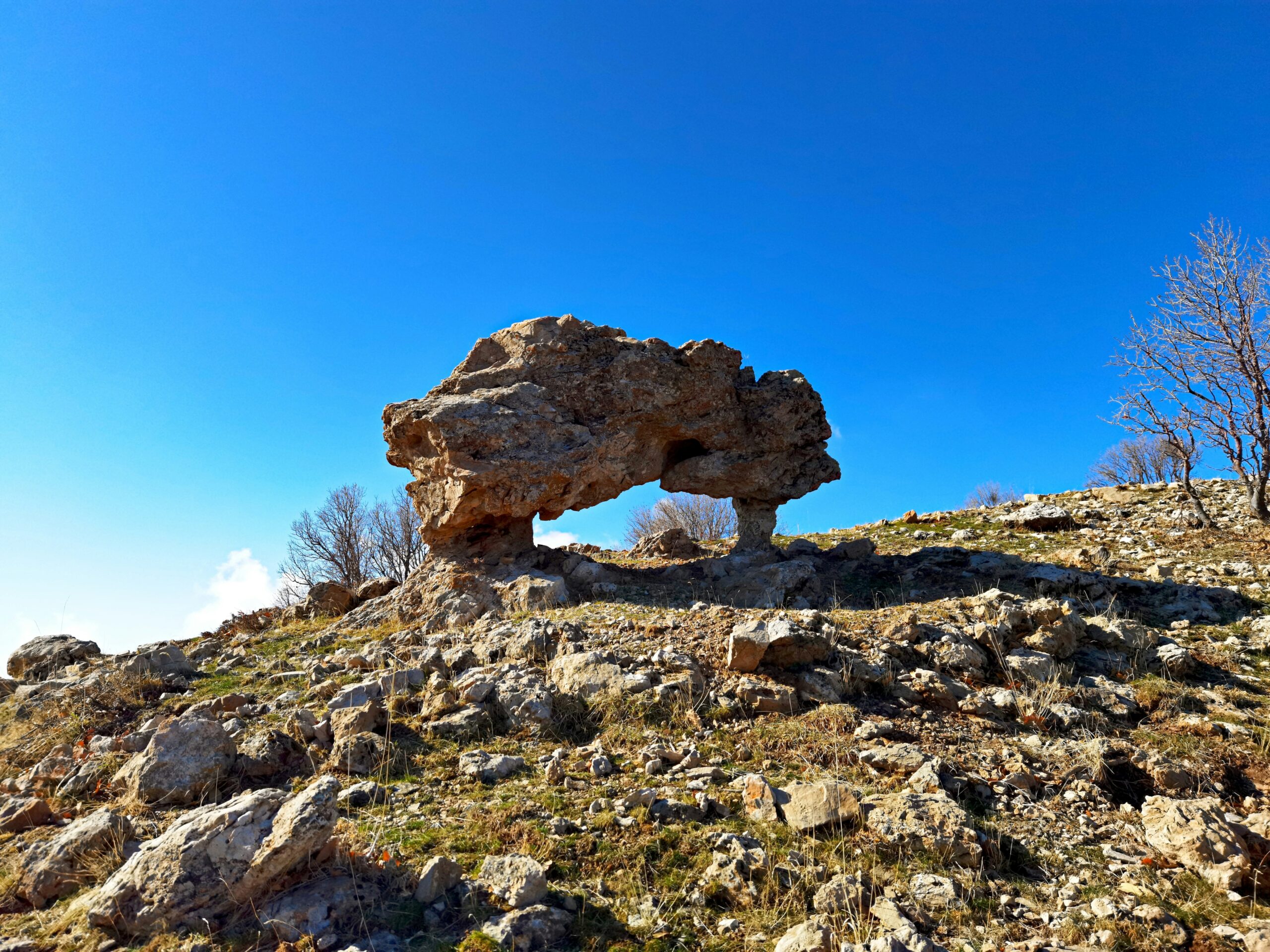 a large rock on a hill